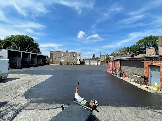 Fresh asphalt seal coating on commercial lot in Summit IL